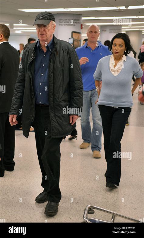 Sir Michael Caine, his wife Shakira Caine and their family arrive at Miami International Airport ...