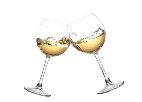 Premium Photo | Clink glasses with white wine.