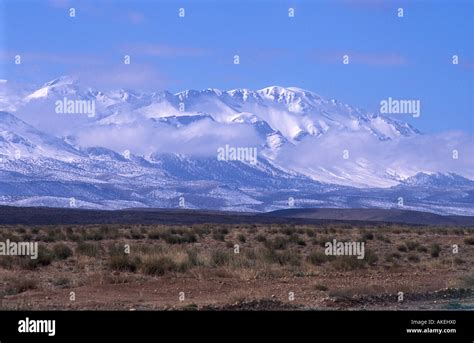 Snow on the High Atlas mountains seen from the N13 road which runs from Errachidia ro Midelt ...