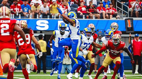 Los Angeles Rams running back Kyren Williams leaps into the end zone on well-executed screen ...