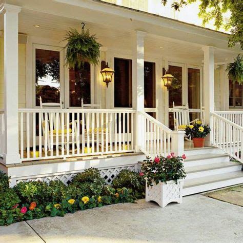 Yellow house front porch | Front porch makeover, Porch makeover, White ...