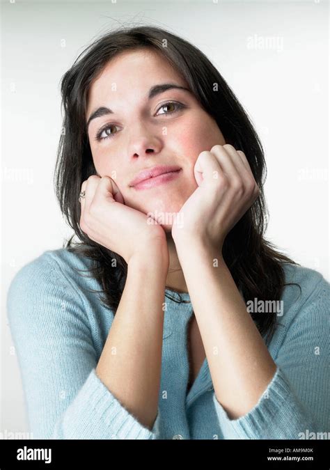 Woman resting head on hands Stock Photo - Alamy