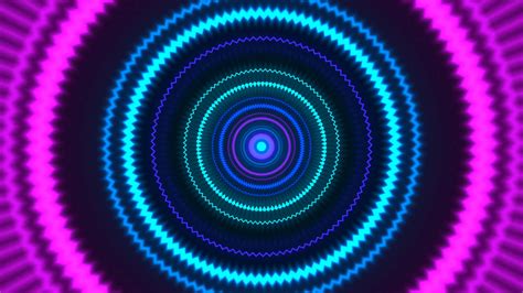 Neon colored circle shapes coming coming the viewer. Motion Background - Storyblocks