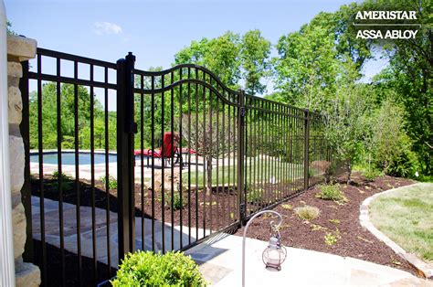 Black classic wrought iron fence and gate in backyard | Backyard landscaping, Iron fence gate ...