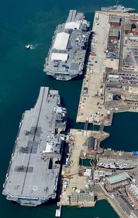HMS Prince of Wales (top) and HMS Queen Elizabeth (bottom) alongside HMNB Portsmouth [1005x1592 ...