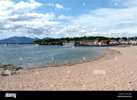 Beach at Millport Great Cumbrae Ayrshire Scotland with Arran mountains providing a backdrop ...