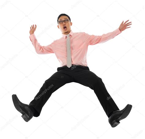 Asian businessman falling backwards — Stock Photo © szefei #27865027