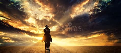 Cowboy on a Horse at Sunset Stock Image - Image of horseback, dawn ...