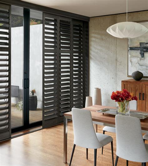 Black sliding glass doors with blinds - Builders Villa