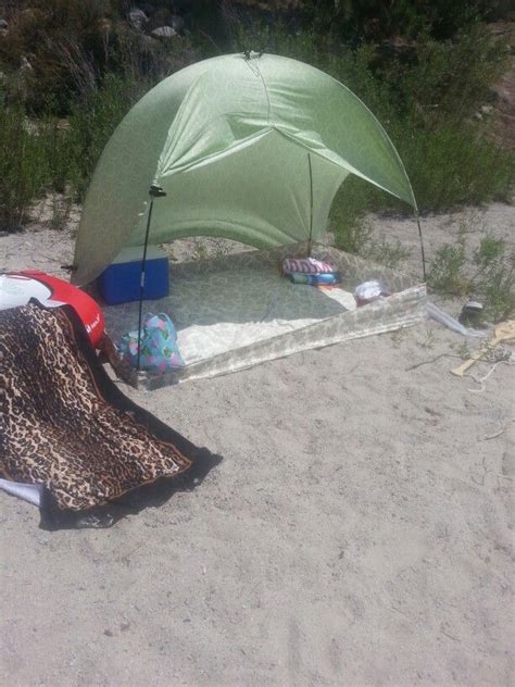 Fitted sheet, flexible tent poles, top sheet, and clamps make a dandy shade shelter ~ photo by ...