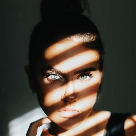 Beautiful woman in the shadow with the sunlight beaming through the window's b… | Portrait ...