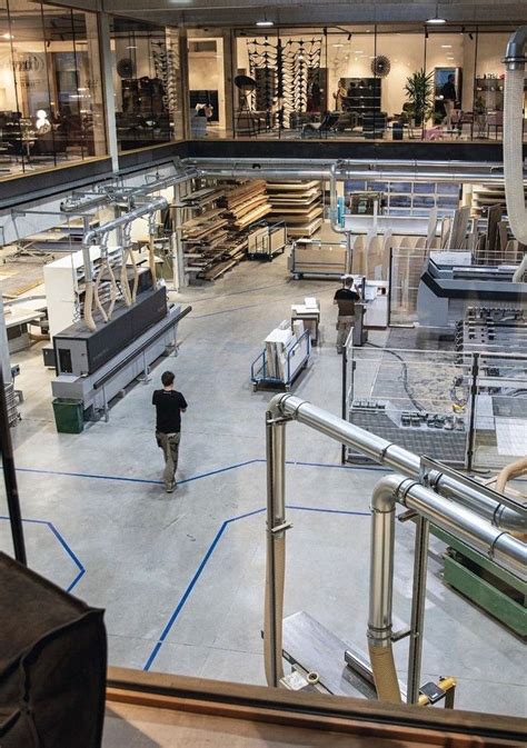 the inside of a factory with workers working on machines and equipment ...