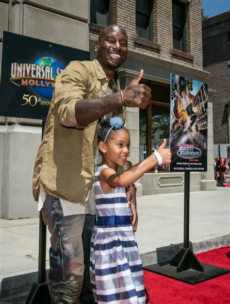 Tyrese Gibson and Daughter at Fast & Furious Ride Opening