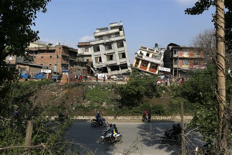 Damaged buildings tilt precariously in Kathmandu. The magnitude-7.8 ...