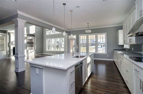 Contemporary kitchen with arctic white quartz countertops, white cabinets… | Grey kitchen walls ...