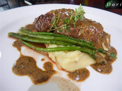 MAIN COURSE Beef fillet mignon served with thyme jus, glazed asparagus and mustard mash potatoes ...