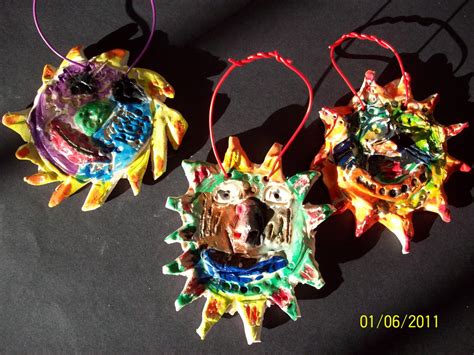 Center School Art: Mexican Clay Suns by Grade 2