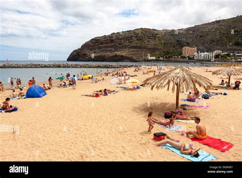 Tourists on the sandy beach of Machico, Funchal, Machico, Ilha da Madeira, Portugal Stock Photo ...