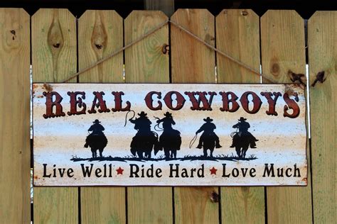 Real Cowboys Sign Hanging On Fence Free Stock Photo - Public Domain Pictures
