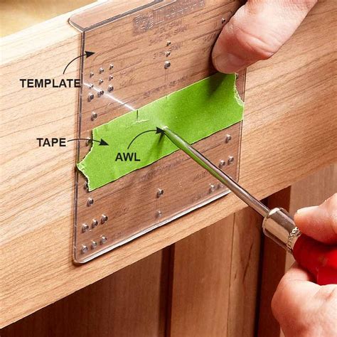 Avoid using the wrong hole on a handle and knob guide by sticking ...