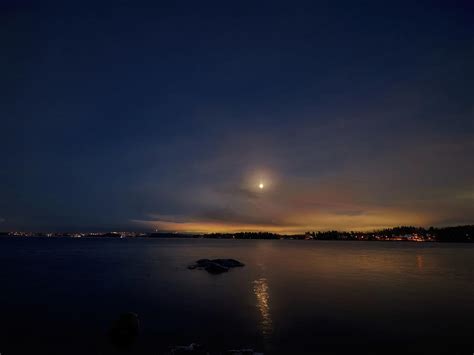 Citylights and the moon. Full moon November 2023 Photograph by Jouko ...