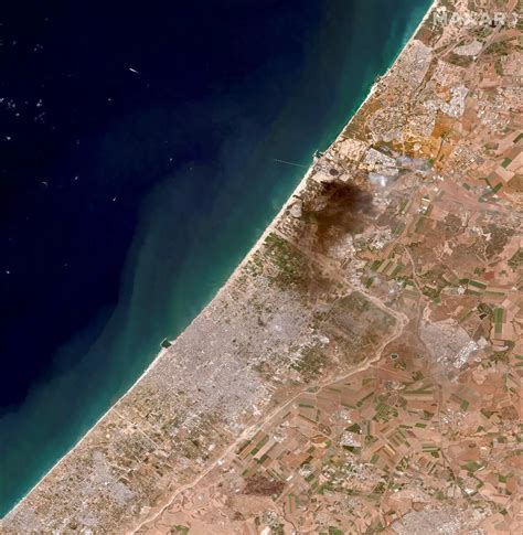 Satellite photos show leveled buildings and plumes of smoke in Gaza ...