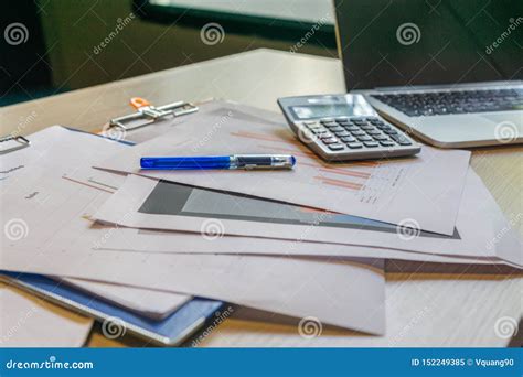 Unorganized Office Desk with Laptop Calculator and Paperwork Stock Image - Image of invoice ...