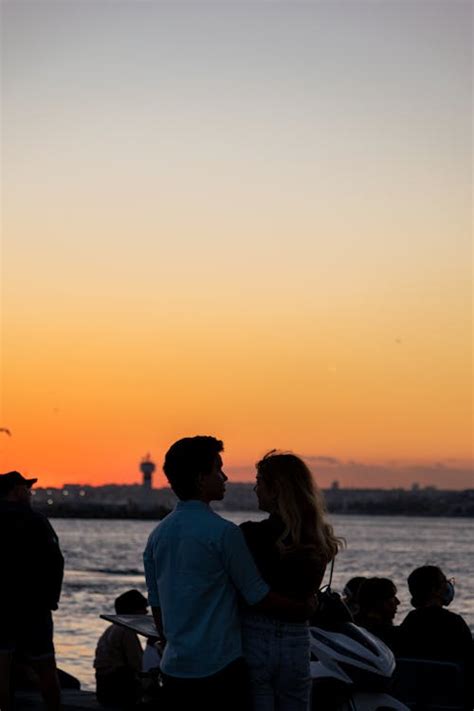 Silhouette of a Couple Hugging during Sunset · Free Stock Photo