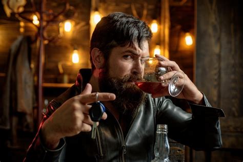 Premium Photo | Handsome bearded businessman is drinking expensive ...