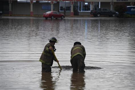 Flash flood hits Jackson, heavy rain causes two sink holes