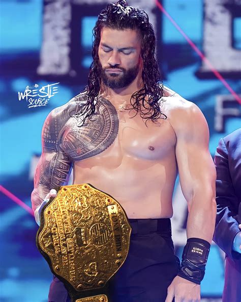 Roman Reigns holding the Big Gold World heavyweight championship title ...