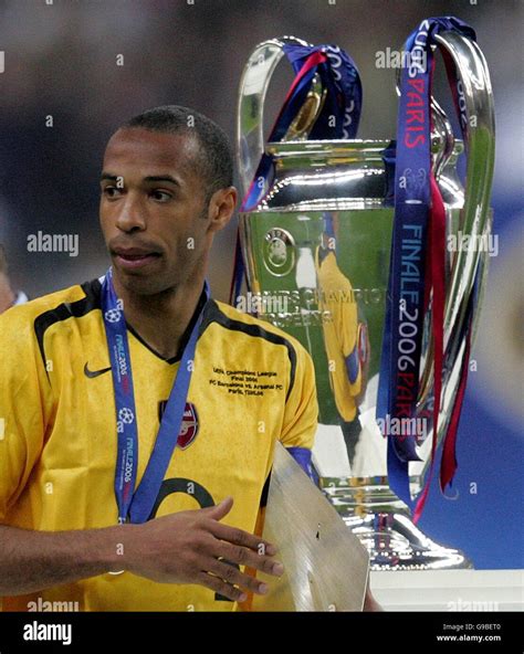 Arsenal's Thierry Henry walks past the trophy after the UEFA Champions ...