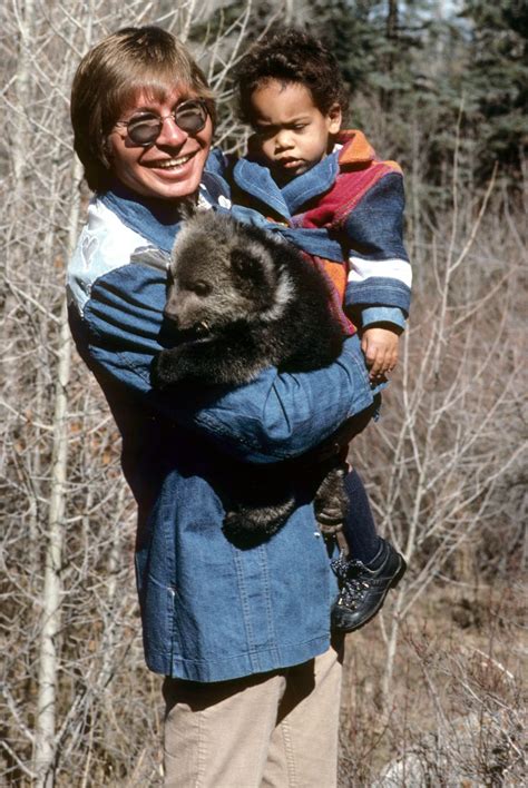 John Holding Son Zak And What Appears To Be A Bear | John denver, John denver family, John ...