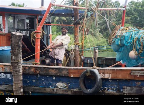 A traditional fishing boat in the Kerala backwaters, India Stock Photo - Alamy