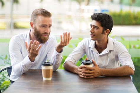 114,800+ Two Men Talking Outside Stock Photos, Pictures & Royalty-Free Images - iStock