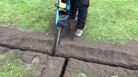 Hand trencher cutting in ready for a tee - YouTube