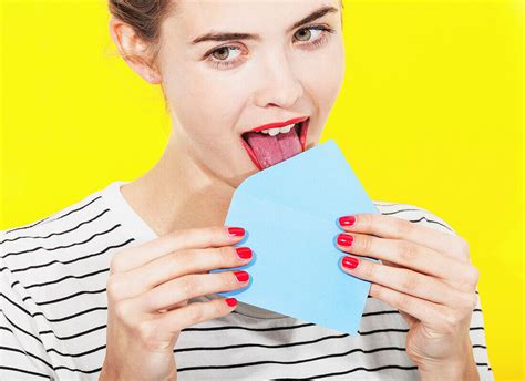 Beautiful woman licking blue envelope … – Bild kaufen – 71086961 lookphotos
