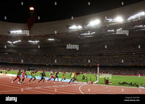 Jamaica's Usain Bolt wins the gold medal and breaks the world 100m record at the National ...