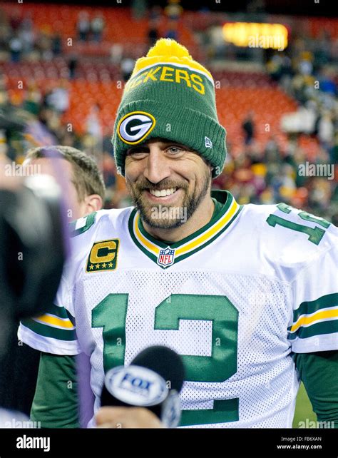 Green Bay Packers quarterback Aaron Rodgers (12) is all smiles as he ...