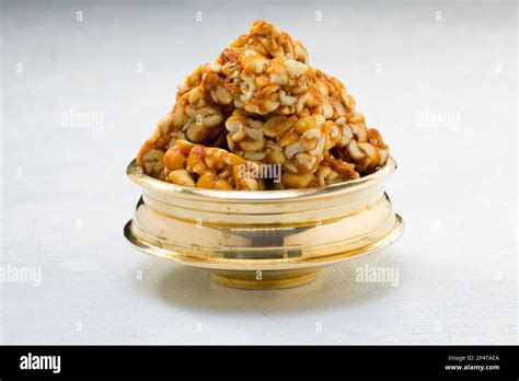 Peanut bar,crunchy sweet peanut bar which is very healthy and tasty snack,arranged on a white ...