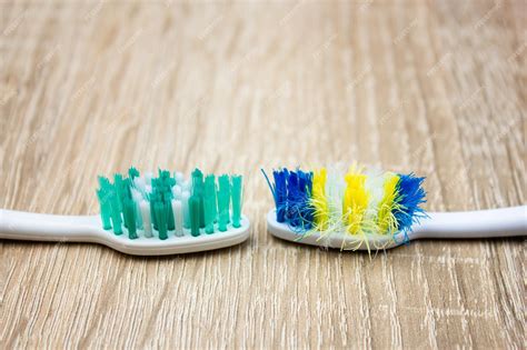 Premium Photo | Old and new toothbrush used and new toothbrush comparison toothbrush with frayed ...