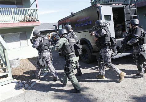 SWAT surrounds apartments to serve warrants in training exercise ...