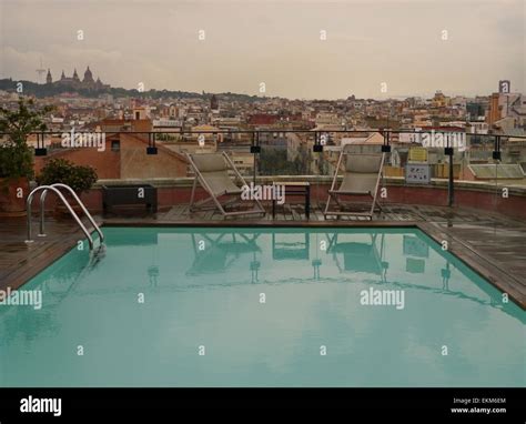 Rooftop swimming pool of the Hotel 1898 in Barcelona, on a rainy day Stock Photo - Alamy