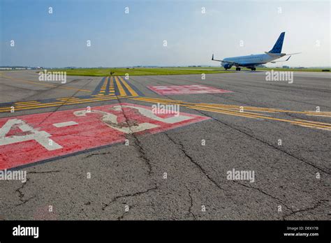 Markings on airplane runway Stock Photo - Alamy