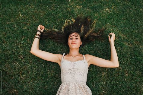 "Teenage Girl Laying In Grass" by Stocksy Contributor "Michelle Edmonds ...