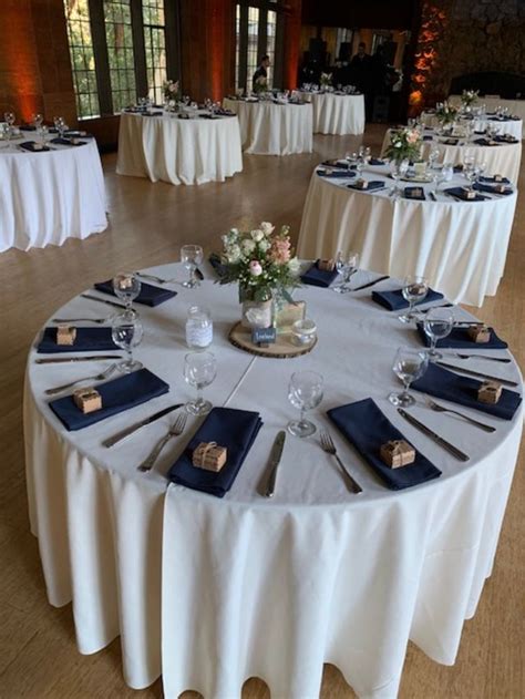 Ivory table linens with navy napkins give a subtle elegance and crisp look | Navy tablecloths ...