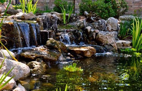 Waterfall created by Clearwater Ponds of Burlington, ON. #WaterfallWednesday | Pond fountains ...