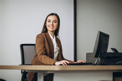 Free Photo | Young business woman working on laptop in office