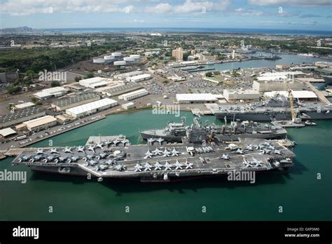 An aerial view of USN Nimitz-class aircraft carrier USS John C. Stennis moored at the Joint Base ...