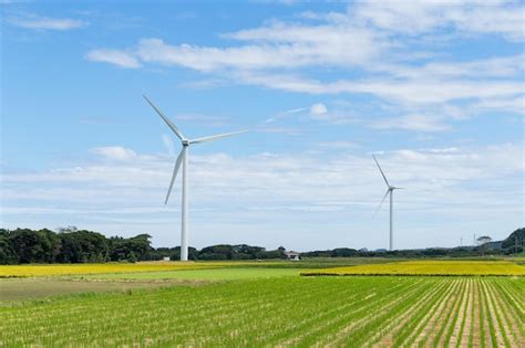 Premium Photo | Wind turbine and field